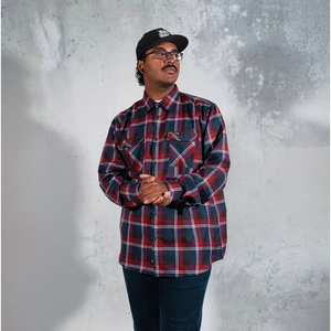 Man in plaid shirt and baseball cap wearing Perserverance Mens Flannel with supreme fabric