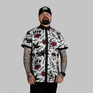 Man in White Rogue Button Up Shirt S/S with rebel reaper tattoo pattern and modern rock style