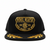 Black cap with gold embroidered design on a white background