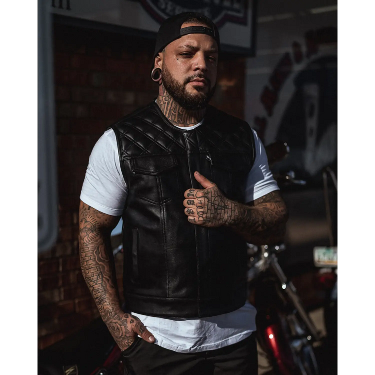 Black leather motorcycle vest with concealed carry pockets and double diamond stitching