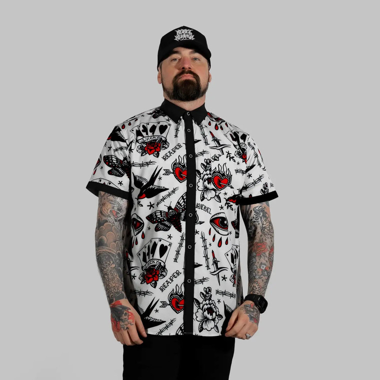 Man in White Rogue Button Up Shirt S/S with rebel reaper tattoo pattern and modern rock style