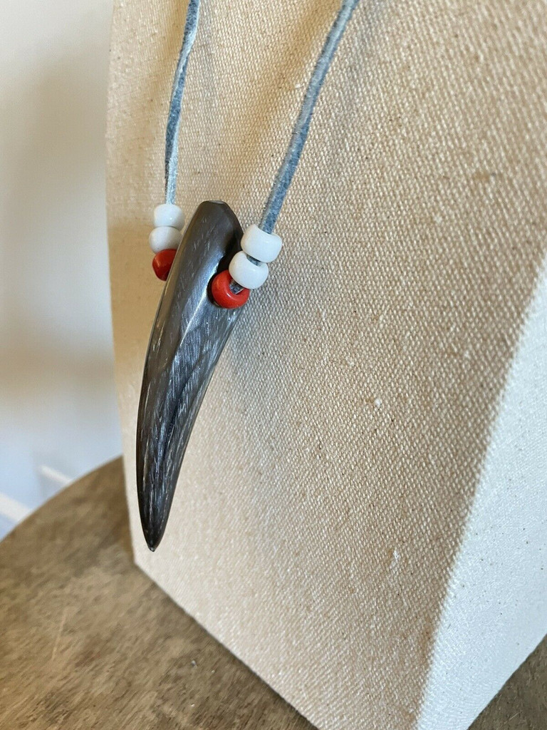Rustic antler necklace with pony beads and gray leather strand.￼