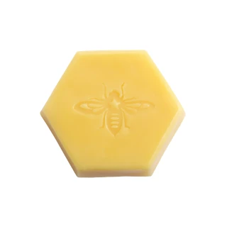 Pure Beeswax Block, 1 lb – hexagon 1 lb block of pure beeswax with bee emblem