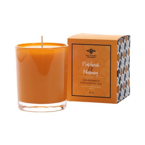 Illuminate Glass Candle, Patchouli & Nutmeg (Orange) – Illuminate glass candle beside its gift box