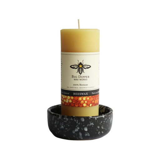 Black ceramic candle bowl with candle 