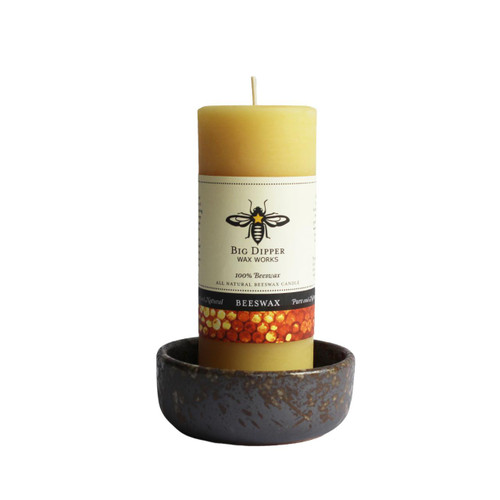 Brown ceramic candle bowl with candle 