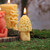 Pure Beeswax Mushroom Candle, Morel – lit beeswax mushroom candles on a mossy woodland table