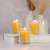 Votive Candle Sampler – lit beeswax votives on a table with dried grasses
