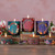 Winter Garden Beeswax Candle Tin, Clove Chamomile (2.7 oz) – lit Winter Garden glass candles and tins on a festive table