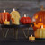 Halloween display with beeswax skull and pumpkin candles.
