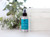 Aromatherapy Mist 4 oz, Balance (Lavender & Peppermint) – on a sunny table with greenery and books