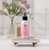 Aromatherapy Mist 4 oz, Love (Geranium, Lavender & Ylang Ylang) – on a wooden tray with fresh flowers