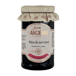 This is an image of a jar of "Andresy Confitures à l'Ancienne" blackcurrant preserves. The jar features a distinctive and stylish label that includes the product name and flavor, with a statement of "Produced in France," emphasizing its origin. Similar to the previous product, this jar is also topped with a gingham-patterned cloth, which enhances its artisanal and gourmet appearance. The overall packaging design suggests a premium quality product tailored to the tastes of gourmet food enthusiasts.