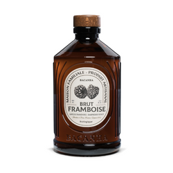 The first image features a front view of a brown glass bottle with a label titled "Brut Framboise," hinting at a raspberry-flavored syrup. The label showcases an illustration of raspberries, reinforcing the syrup's flavor. The term "Brut" likely denotes a pure or bold raspberry flavor, perhaps with less added sweetness. The phrase "Eau de Vie" on the label traditionally refers to distilled spirits, but here it might be signifying the essence or core flavor of the raspberries. Below the illustration, the brand name "BACANHA" is visible.