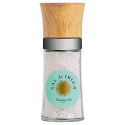 Savor the essence of the Mediterranean with Sal de Ibiza's "Molinillo" Salt Mill. This exquisite piece combines functionality with natural beauty, perfect for gourmet enthusiasts and culinary aficionados alike. Featuring a robust glass body filled with SAL de IBIZA's coarsest "Molino" sea salt—reminiscent of crystalline sugar candy—this mill is a visual treat. Crowned with a finely crafted beech wood head, the design showcases simplicity and elegance. The durable ceramic grinder, seamlessly integrated, guarantees a flawless salt granulation, preserving the purity and fresh flavors of the sea. Each mill measures 36.5 cm in circumference and 4.5 cm in height, designed not only to grace your dining experience but also to stand as a testament to sustainable luxury. With Sal de Ibiza's commitment to natural, additive-free sea salt rich in vital minerals, this "Molinillo" Salt Mill promises to be the centerpiece of your table, inviting a sprinkle of Ibizan sunshine with every twist.