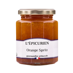 A 320g glass jar of L’Épicurien Orange Spritz jam, featuring a white label with the brand's logo and product name. The jar is filled with a vibrant orange spread, reflecting the blend of sweet oranges and the sparkling notes of the classic Spritz cocktail.