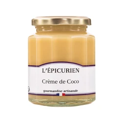 Coconut curd in a clear glass jar.