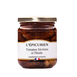 Sundried tomatoes in oil from L'Epicurien in a clear jar with gold lid.