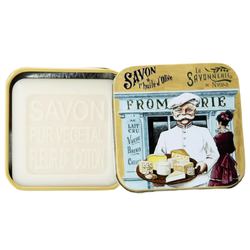 La Savonnerie de Nyons “Cheese Maker” French soap in a reusable decorative metal tin featuring a vintage cheese-making illustration, 3.5 oz cotton flower–scented soap enriched with shea butter and Nyons olive oil.
