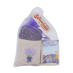 Retail display of multiple French lavender soap bars paired with lavender flower sachets filled with dried Provence lavender, arranged for boutique merchandising.