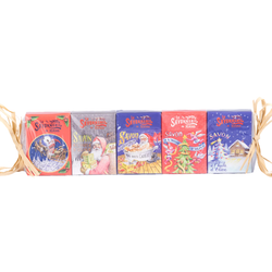 Set of five miniature French guest soaps (25g) in festive Christmas packaging, featuring holiday scents like orange-cinnamon and gingerbread, enriched with shea butter and olive oil.