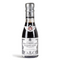 The image presents a small bottle of Giuseppe Giusti Aceto Balsamico di Modena. The bottle is dark, which could indicate the color of the glass or the balsamic vinegar itself, with a narrow neck and a metallic silver cap. Adorning the cap is a red and white label featuring the Giusti family crest, a white cross on a red shield, signifying the brand's heritage.

The main label wraps around the bottle's lower half, with an elegant, vintage design predominantly in white with black text and some grey ornamental detailing. The text "Gran Deposito Aceto Balsamico di Modena Giuseppe Giusti" is displayed prominently, suggesting this is a product from the Giusti’s historical "Gran Deposito" line of balsamic vinegars.

The label appears to bear additional information that would typically outline the vinegar's characteristics, potentially including its age, tasting notes, and serving suggestions. The overall appearance conveys that this is a premium product from an established balsamic vinegar producer.