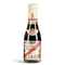 This image displays a bottle of Giuseppe Giusti Aceto Balsamico di Modena. The bottle is capped with a cream-colored seal, and the neck label features the distinctive Giusti family crest, a red shield with a white cross. The main label has a beige background with red and black text, along with gold accents that lend an air of elegance and tradition.

The label reads "Gran Deposito Aceto Balsamico di Modena Giuseppe Giusti," placing it within the esteemed Gran Deposito line. The intricate label design suggests that this balsamic vinegar is a product of careful craftsmanship and heritage. The overall presentation is consistent with the quality expected from Giusti, a historic producer of balsamic vinegar.