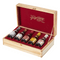 The image features an open wooden gift box containing a selection of six balsamic vinegar bottles from the Giuseppe Giusti collection. The box is light-colored wood, possibly pine, with gold hinges and a clasp, emphasizing a luxurious yet rustic charm. Inside, the box is lined with rich red velvet, and the inside of the lid displays the Giuseppe Giusti logo elegantly scripted in gold lettering.

Each bottle has its own distinct label, suggesting a variety of ages or flavor profiles within the collection. The bottles are neatly arranged in a row and appear to be small, possibly sampler-sized, which would allow for tasting multiple varieties. The presentation and quality of the box set suggest it is a premium product, designed for connoisseurs or as a high-end gift.