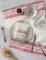 Elegant striped linen tea towel featuring warm brick red accents on natural linen in a classic French kitchen style.
