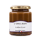 Coffee curd in clear glass jar with gold lid.