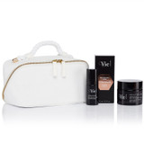 Time Control Deep Wrinkle Firming Rich Cream and the Hydra Volume Lip Plumping Serum next to a white cosmetic pouch.