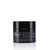 A dark jar of night balm labeled "Vie Collection" with text in French and English, showcasing a sleek, modern design.