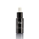 A sleek black bottle of VIE Collection Vita C serum with a dropper cap, labeled as a concentrated solution.