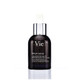 A dark glass serum bottle with a dropper cap, labeled "Sérum de Vie," resting on a textured stone surface.