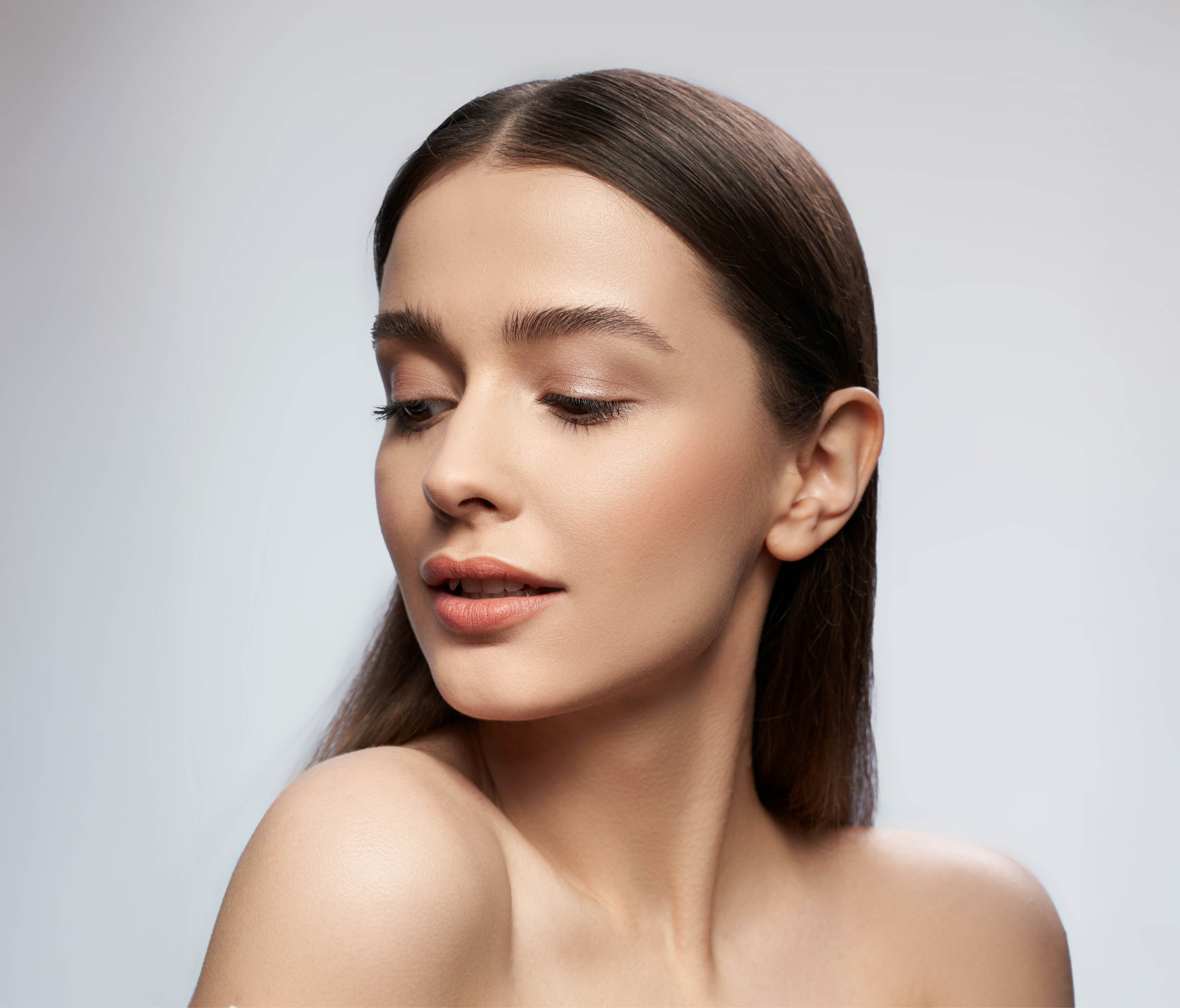 Woman gazing over her shoulder.