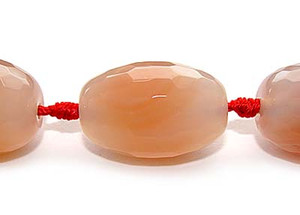 18x28mm Peach Red Agate Faceted Rice Beads. 12 Beads Per Strand. 18x28mm Peach Red Agate Faceted Rice Beads. 12 Beads Per Strand.