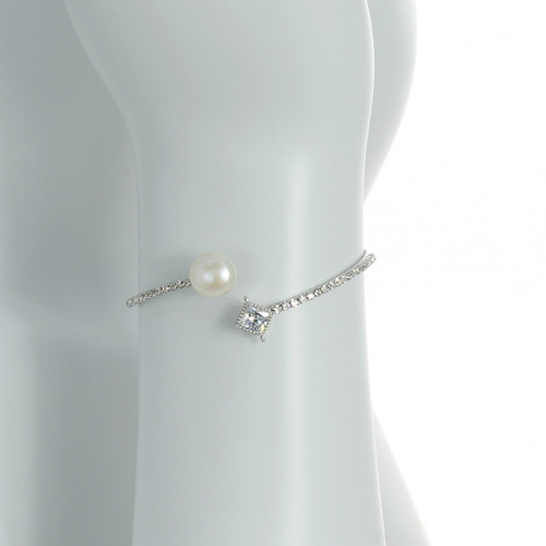 Crystal Coast - Pearl Bracelet zoom view: Silver bangle bracelet set with CZs around one white freshwater pearl 10mm, and one large accent CZ, one size. Crystal Coast - Pearl Bracelet zoom view: Silver bangle bracelet set with CZs around one white freshwater pearl 10mm, and one large accent CZ, one size.