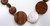 Guanacaste - Coin Pearl & Natural Wood Necklace zoom on white coin pearls and natural wood circles,  Freshwater Pearl Necklace, 36” in length, rope length which slips over the head, Natural dark wood polished circles in 2 sizes (25 mm and 13 mm) interspersed with semi-polished agate (25mm) and luminous white freshwater coin pearls (21 mm), Converts to choker style with included mixed-metal converter, Part of the exclusive Naughton Braun Pura Vida Collection