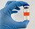 Lab technician holding vial with CAUTION NON-STERILE label adhered to surface
