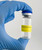 Lab manager holding glass bottle with EXPIRATION DATE Caution Label
