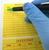 Lab technician writing on inventory material label