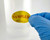M059 SAMPLED Material Label being applied to lab bottle containing chemical sample