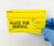 Lab technician applying yellow Waste for Disposal Label to waste container