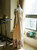 Back View of Empire Waist Dress under natural sunlight (Champagne + Light Ivory Version)