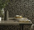 1838 Wallcoverings 1804-121-01 - Aurora Interlocking pebbles Black Gold 1838 Wallpaper - shown in room setting