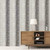 Galerie G78271 - Atmosphere SUBLIME STRIPE DARK GREY Galerie Wallpaper - shown in room setting