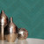 Galerie NHW1020 - Enchanted Linen Effect Emerald Galerie Wallpaper - roll and label close-up Galerie NHW1020 - Enchanted Linen Effect Emerald Galerie Wallpaper - roll and label close-up
