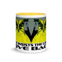 White ceramic mug with mirrored yellow-and-blue Dante portraits, yellow interior, and Love insists the loved loves Back text