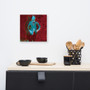 Square Manet Self Portrait canvas above kitchen wood counter with black mugs and utensil basket.