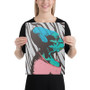 Woman in black shirt holding vertical Da Vinci teal-and-pink caricature canvas with zebra stripes.